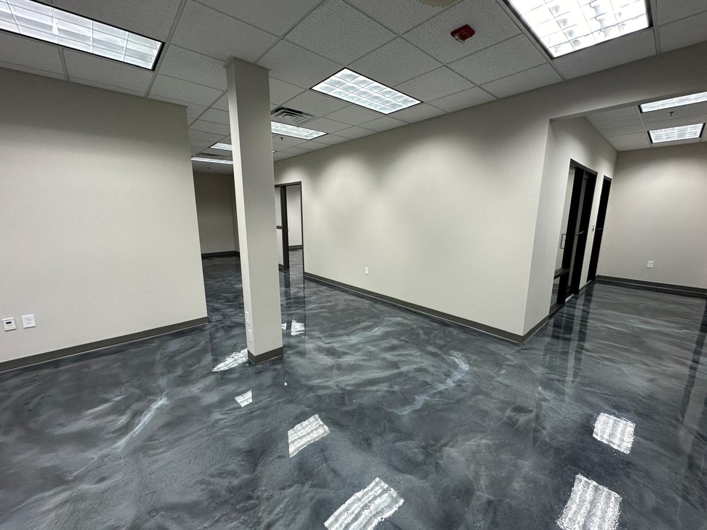 HR office after remodel with new finishes and metallic epoxy floor
